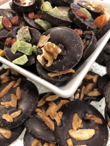 Cítricos (naranja, limón pomelo) y ciruela pasa bañados en chocolate negro (100 gr)