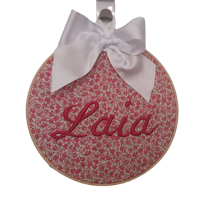 Cuadro redondo de tela con nombre