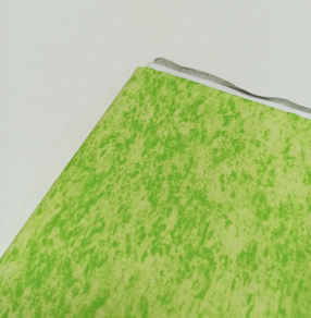 Tela de algodón marmoleada verde pistacho (0,5 m)